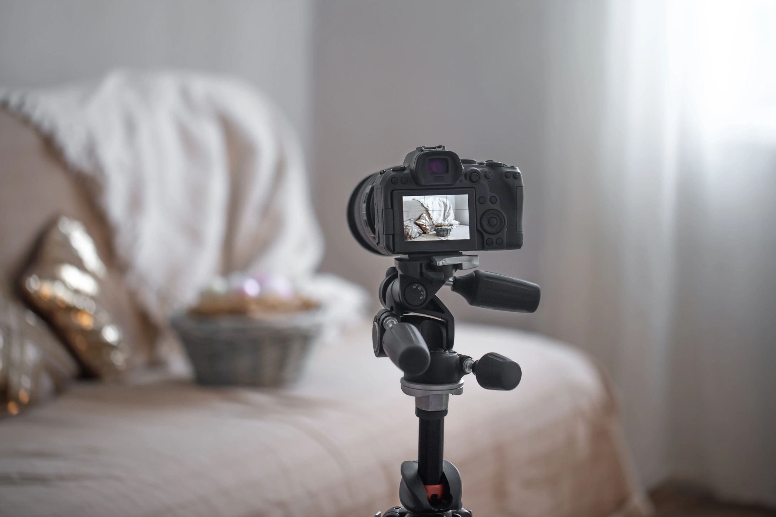 Camera on tripod photographing an interior