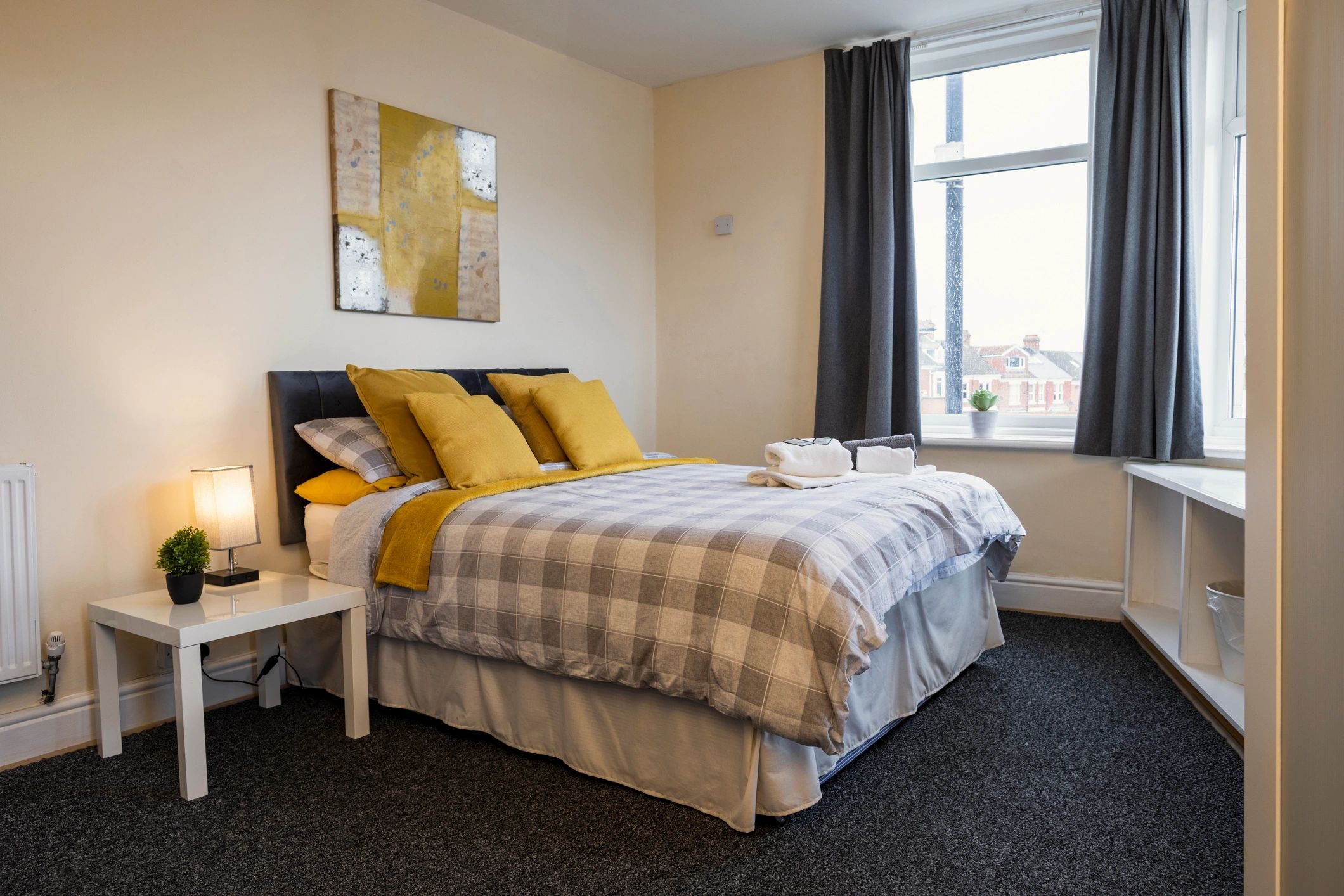 Clean hotel-style bedroom with crisp linens