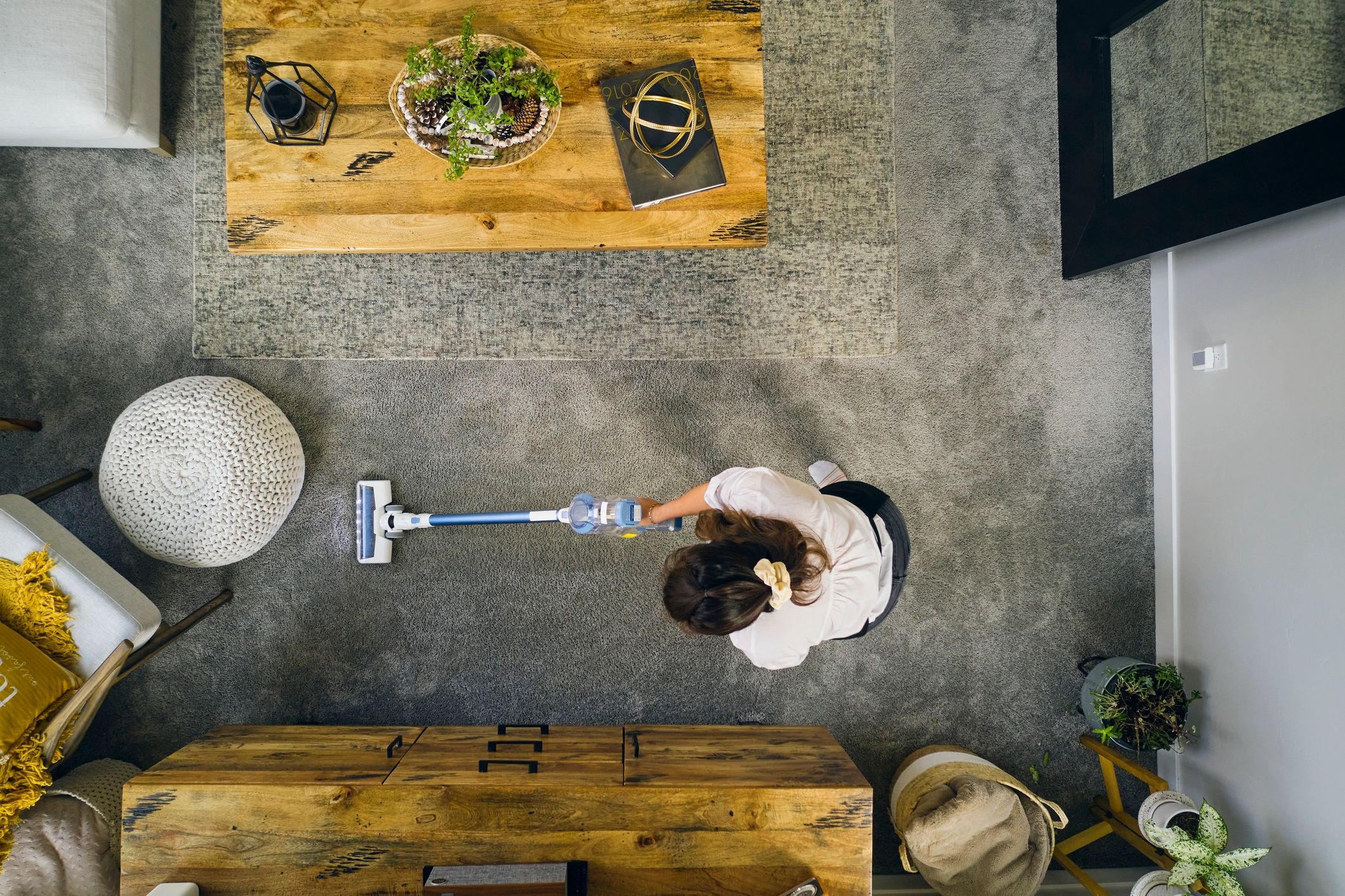 Professional cleaner preparing supplies in an apartment