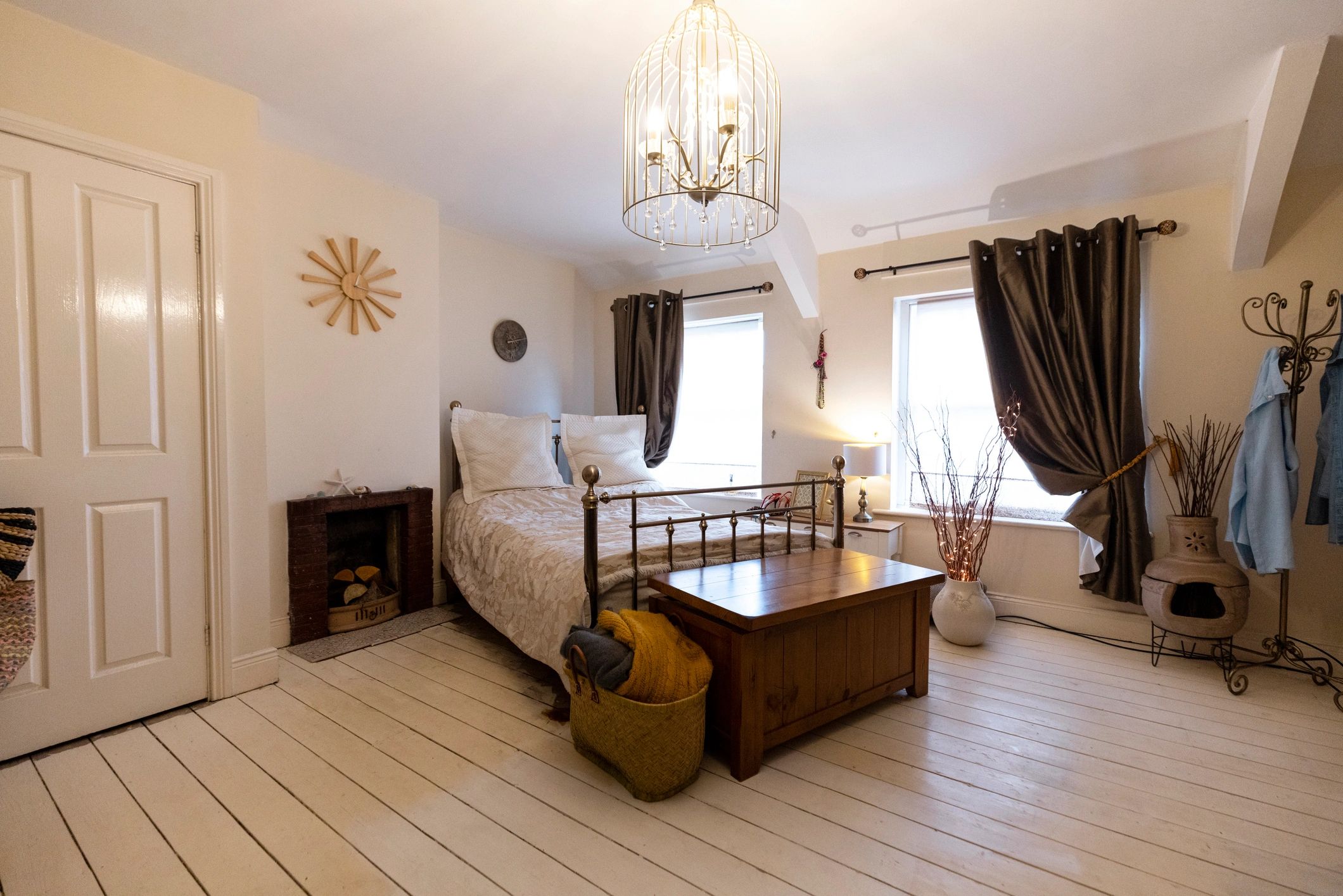 Cozy bedroom photo with warm lighting and tidy styling