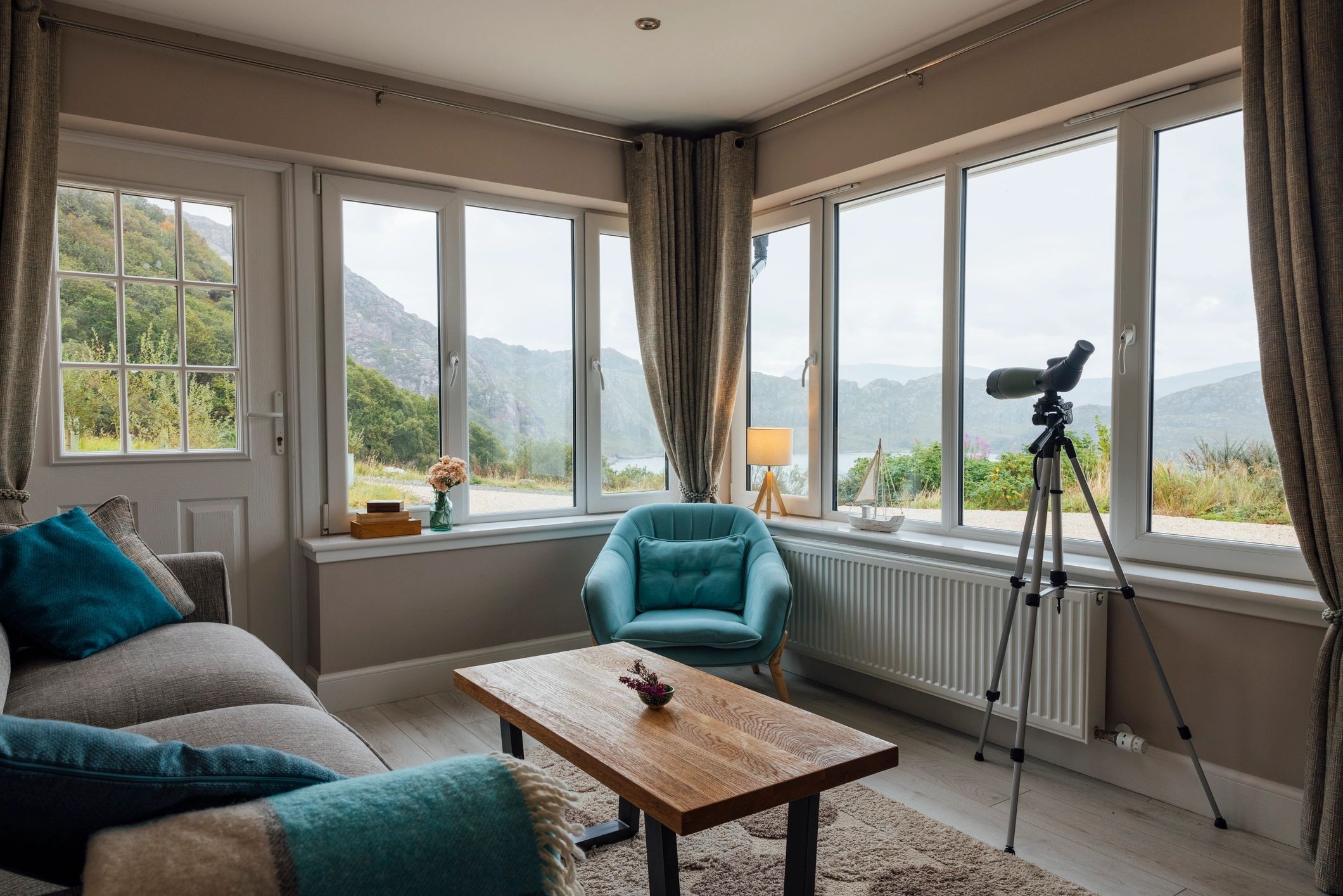 Camera on tripod capturing a bright interior space